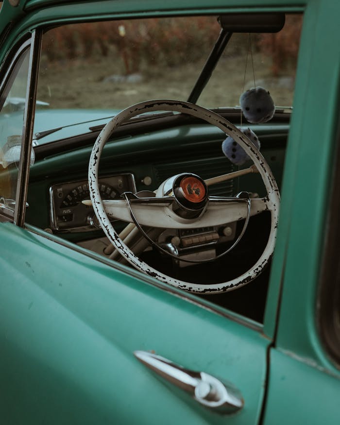 Explore the classic elegance of a teal 1950s car interior parked in Portland.